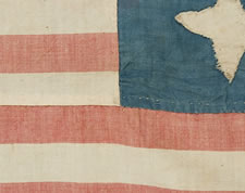 A MASTERPIECE OF FOLK ART IN EARLY FLAG-MAKING:  14 STARS AND 21 STRIPES, WHALEBONE EYELETS, A HIGHLY UNUSUAL FLAG WITH POSSIBLE VERMONT & CIVIL WAR ASSOCIATIONS