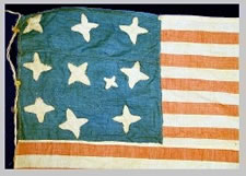 A MASTERPIECE OF FOLK ART IN EARLY FLAG-MAKING:  14 STARS AND 21 STRIPES, WHALEBONE EYELETS, A HIGHLY UNUSUAL FLAG WITH POSSIBLE VERMONT & CIVIL WAR ASSOCIATIONS