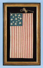 A MASTERPIECE OF FOLK ART IN EARLY FLAG-MAKING:  14 STARS AND 21 STRIPES, WHALEBONE EYELETS, A HIGHLY UNUSUAL FLAG WITH POSSIBLE VERMONT & CIVIL WAR ASSOCIATIONS