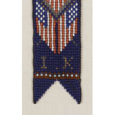 NATIVE AMERICAN BEADED WATCH FOB WITH A FEDERAL SHIELD AND CROSSED AMERICAN FLAGS, 1890-1910