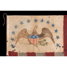 ONE OF THE TWO EARLIEST KNOWN EXAMPLES OF THE FLAG OF THE REVENUE MARINE (a.k.a., REVENUE CUTTER SERVICE), WITH A HAND-PAINTED EAGLE, AN ARCH OF 13 BLUE-PAINTED STARS, HAVING GREAT FOLK QUALITIES, AND 13 VERTICAL STRIPES, LATE 1830’s-1860