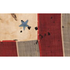 ONE OF THE TWO EARLIEST KNOWN EXAMPLES OF THE FLAG OF THE REVENUE MARINE (a.k.a., REVENUE CUTTER SERVICE), WITH A HAND-PAINTED EAGLE, AN ARCH OF 13 BLUE-PAINTED STARS, HAVING GREAT FOLK QUALITIES, AND 13 VERTICAL STRIPES, LATE 1830’s-1860