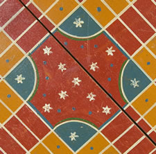 ORANGE PARCHEESI BOARD WITH WHIMSICAL MEDALLIONS, POLKA DOTS, & SNOWFLAKE STARS, circa 1885