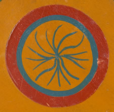 ORANGE PARCHEESI BOARD WITH WHIMSICAL MEDALLIONS, POLKA DOTS, & SNOWFLAKE STARS, circa 1885