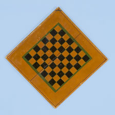 ORANGE PARCHEESI BOARD WITH WHIMSICAL MEDALLIONS, POLKA DOTS, & SNOWFLAKE STARS, circa 1885