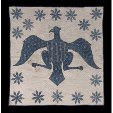 PRE-CIVIL WAR AMERICAN CRIB QUILT WITH A FEDERAL EAGLE, 16 EIGHT-POINTED STARS, AND 16 STRIPES UPON ITS BREAST, BLUE CALICO ON WHITE, CIRCA 1830-1850