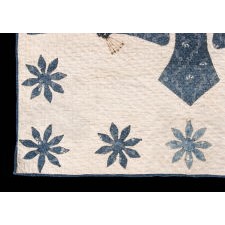 PRE-CIVIL WAR AMERICAN CRIB QUILT WITH A FEDERAL EAGLE, 16 EIGHT-POINTED STARS, AND 16 STRIPES UPON ITS BREAST, BLUE CALICO ON WHITE, CIRCA 1830-1850