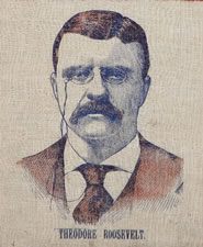 PREVIOUSLY UNDOCUMENTED, TEDDY ROOSEVELT PORTRAIT BANNER WITH LARGE EAGLE & "WELCOME OUR PRESIDENT" TEXT, ONE OF THE MOST ATTRACTIVE, EXISTING, PRINTED, T.R. TEXTILES