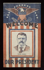 PREVIOUSLY UNDOCUMENTED, TEDDY ROOSEVELT PORTRAIT BANNER WITH LARGE EAGLE & "WELCOME OUR PRESIDENT" TEXT, ONE OF THE MOST ATTRACTIVE, EXISTING, PRINTED, T.R. TEXTILES