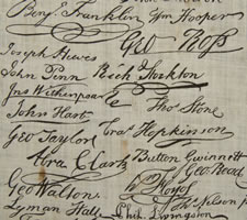 PRINTED COTTON KERCHIEF GLORIFYING THE DECLARATION OF INDEPENDENCE, WITH TEXT AND REPRODUCED SIGNATURES, MADE FOR THE 1876 CENTENNIAL INTERNATIONAL EXPOSITION