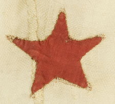 PRIVATE OWNER'S YACHT BURGEE, ENTIRELY HAND-SEWN, WITH 13 RED STARS ARRANGED IN A WREATH, SURROUNDING A SINGLE, LARGE, NAVY BLUE CENTER STAR, ALL ON A WHITE GROUND, CA 1860-1880, SIGNED ON THE HOIST "M. HEMINGWAY"