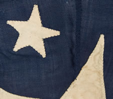 PRIVATE OWNER'S YACHT BURGEE, ENTIRELY HAND-SEWN, WITH A HUGE WHITE CENTER STAR, FLANKED BY A SMALL WHITE STAR BETWEEN EACH ARM AND 2 MORE ALONG THE HOIST, ALL ON A NAVY BLUE GROUND, CA 1860-1880, SIGNED IN PENCIL "M. HEMINGWAY"