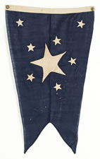 PRIVATE OWNER'S YACHT BURGEE, ENTIRELY HAND-SEWN, WITH A HUGE WHITE CENTER STAR, FLANKED BY A SMALL WHITE STAR BETWEEN EACH ARM AND 2 MORE ALONG THE HOIST, ALL ON A NAVY BLUE GROUND, CA 1860-1880, SIGNED IN PENCIL "M. HEMINGWAY"