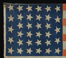 RARE 34 STAR PARADE FLAG, MADE FOR THE 1880 PRESIDENTIAL CAMPAIGN OF GARFIELD AND ARTHUR, THE LARGEST EXAMPLE KNOWN FROM THIS ELECTION, WITH ESPECIALLY WHIMSICAL TEXT