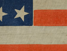 RARE 34 STAR PARADE FLAG, MADE FOR THE 1880 PRESIDENTIAL CAMPAIGN OF GARFIELD AND ARTHUR, THE LARGEST EXAMPLE KNOWN FROM THIS ELECTION, WITH ESPECIALLY WHIMSICAL TEXT