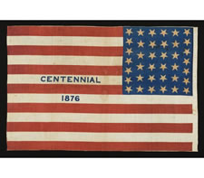 RARE 38 STAR FLAG WITH "1876 CENTENNIAL" ADVERTISING & GOLD STARS, MADE FOR THE PHILADELPHIA CENTENNIAL INTERNATIONAL EXPOSITION