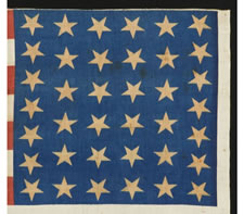 RARE 38 STAR FLAG WITH "1876 CENTENNIAL" ADVERTISING & GOLD STARS, MADE FOR THE PHILADELPHIA CENTENNIAL INTERNATIONAL EXPOSITION