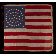 RARE AND EXCEPTIONAL 44 STAR UNITED STATES INFANTRY BATTLE FLAG WITH A MEDALLION CONFIGURATION, GOLD FRINGE, AND RED WOOL TIES, LATE INDIAN WARS, WYOMING STATEHOOD, 1890-1896