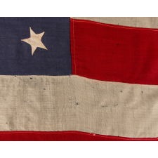 RARE AND EXCEPTIONAL 44 STAR UNITED STATES INFANTRY BATTLE FLAG WITH A MEDALLION CONFIGURATION, GOLD FRINGE, AND RED WOOL TIES, LATE INDIAN WARS, WYOMING STATEHOOD, 1890-1896