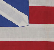 RARE HOMEMADE EXAMPLE OF THE "GRAND UNION", THE FIRST NATIONAL FLAG OF AMERICA, LIKELY MADE IN 1926 FOR THE SESQUICENTENNIAL OF AMERICAN INDEPENDENCE