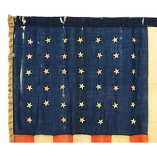 RARE INDIAN WARS PERIOD UNION INFANTRY BATTLE FLAG WITH 40 STARS IN A NOTCHED CONFIGURATION AND WITH A CANDY-STRIPE FRINGE, AN UNOFFICIAL STAR COUNT, ACCURATE FOR JUST 6 DAYS, NOVEMBER 2ND - 6TH, 1889, PROBABLY MADE ON THE GREAT PLAINS