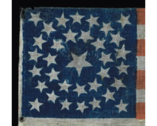 RARE PARADE FLAG MADE FOR THE 1864 CAMPAIGN OF REPUBLICAN CANDIDATES ABRAHAM LINCOLN & ANDREW JOHNSON, WITH 34 STARS IN A DOUBLE WREATH CONFIGURATION AND BLUE TEXT