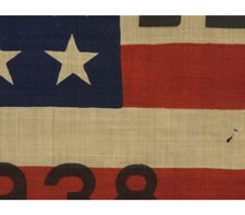 RARE AND STRIKING 48 STAR FLAG WITH BOLD OVERPRINTED TEXT ADVERTISING THE 75TH ANNIVERSARY OF THE BATTLE OF GETTYSBURG IN 1938