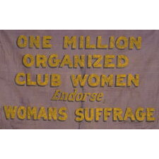 RARE VIOLET & YELLOW SUFFRAGETTE PARADE BANNER WITH PAINTED TEXT THAT READS: “ONE MILLION ORGANIZED CLUB WOMEN ENDORSE, WOMANS SUFFRAGE.” MADE circa 1910-1920, THIS IS THE PLATE EXAMPLE FROM THE BEST PICTORIAL REFERENCE ON SUFFRAGE COLLECTING