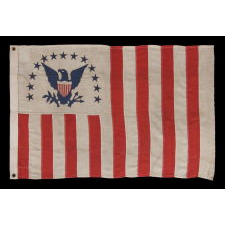 REVENUE CUTTER SERVICE ENSIGN WITH A BLUE EAGLE AMID AN ARCH OF 13 BLUE STARS, ON A WHITE FIELD, AND 16 VERTICAL RED AND WHITE STRIPES, CA 1890-1900