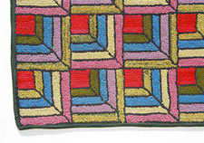 ROOM-SIZED HOOKED RUG IN THE LOG CABIN PATTERN WITH GREAT COLORS