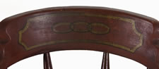 SET OF 12 BARREL-BACK WINDSOR CHAIRS, IN RED PAINT, WITH THE 3-LINK CHAIN (FRIENDSHIP, LOVE, AND TRUTH) OF THE ODD FELLOWS ON EACH CREST RAIL, CA 1850-70