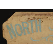 SHIELD-SHAPED BANNER FROM THE NORTH JERSEY SHORE WOMAN'S SUFFRAGE LEAGUE, HANDED DOWN THROUGH THE FAMILY OF ITS PRESIDENT, VIOLA AGUERO, WITH A LARGE ARCHIVE OF MATERIAL THAT INCLUDES AN IMAGE OF HER ACTUALLY HOLDING THE BANNER