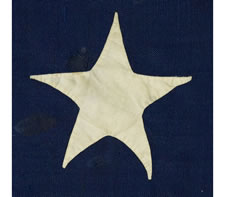 THE SMALLEST, SIGNED, ENTIRELY HANDSEWN 13 STAR FLAG THAT I HAVE EVER COME IN CONTACT WITH, MADE BY LAMPRELL & MARBLE, BOSTON, THE STARS ARRANGED IN AN OVAL VARIANT OF THE 3RD MARYLAND PATTERN, CIVIL WAR PERIOD (1861-65), EXTRAORDINARY AMONG KNOWN EXAMPLE