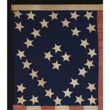 SPECTACULAR 34 STAR FLAG WITH AN EXTREMELY RARE AND BEAUTIFUL DIAMOND CONFIGURATION, AND AN APPLIED BANNER WITH A STENCILED PATRIOTIC SLOGAN, AMONG THE BEST EXAMPLES I HAVE EVER OWNED, KANSAS STATEHOOD, OPENING TWO YEARS OF THE CIVIL WAR, 1861-63