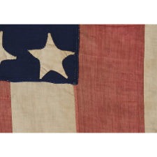 SPECTACULAR 34 STAR FLAG WITH AN EXTREMELY RARE AND BEAUTIFUL DIAMOND CONFIGURATION, AND AN APPLIED BANNER WITH A STENCILED PATRIOTIC SLOGAN, AMONG THE BEST EXAMPLES I HAVE EVER OWNED, KANSAS STATEHOOD, OPENING TWO YEARS OF THE CIVIL WAR, 1861-63