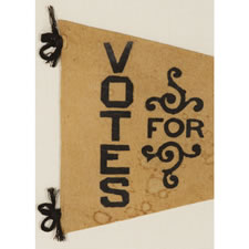 TRIANGULAR FELT SUFFRAGETTE PENNANT WITH AN INTERESTING DESIGN AND TEXT THAT READS:  "VOTES FOR WOMEN", 1910-1920