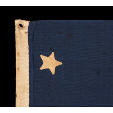 U.S. NAVY SMALL BOAT ENSIGN WITH 13 STARS IN THE 4-5-4 PATTERN, A VERY EARLY EXAMPLE, MADE circa 1835-1850’s, ENTIRELY HAND-SEWN AND IN A TINY SCALE AMONG ITS COUNTERPARTS