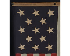 UNITED STATES NAVY SMALL BOAT ENSIGN WITH 13 HAND-SEWN STARS, MADE BY THE NAVY IN THE PHILIPPINES IN FEBRUARY OF 1902