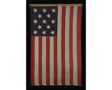 UNITED STATES NAVY SMALL BOAT ENSIGN WITH 13 HAND-SEWN STARS, MADE BY THE NAVY IN THE PHILIPPINES IN FEBRUARY OF 1902