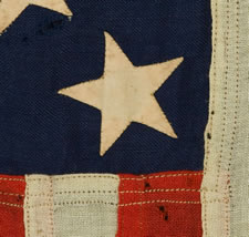 UNITED STATES NAVY SMALL BOAT ENSIGN WITH 13 HAND-SEWN STARS, ONE OF THE SMALLEST THAT I HAVE EVER SEEN IN THIS TINY SIZE, MADE BY THE NAVY IN THE PHILIPPINES IN 1903