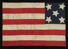 VERY RARE SEWN FLAG WITH 5 STARS ON A BLUE CALICO CANTON AND 8 STRIPES, MADE FOR THE 1860 CAMPAIGN OF ABRAHAM LINCOLN & HANNIBAL HAMLIN, WITH SPECIFIC HISTORY TO A PITTSBURG AREA FAMILY, SAID TO HAVE BEEN CARRIED IN A TORCHLIT PARADE