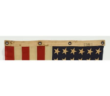 WWII BATTLE FLAG FROM THE U.S.S. FLINT WITH 48 STARS, BROUGHT HOME BY FIREMAN 2ND CLASS F. W. PERRINE, EMBROIDERED WITH HIS NAME, THE SHIP'S NAME, AND DATES OF SERVICE