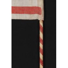 WWII PERIOD HOMEMADE PARADE FLAG WITH 20 STARS, 15 STRIPES THAT START AND END ON WHITE, AND A CANDY CANE STRIPED STAFF, MADE TO WELCOME U.S. SOLDIERS AFTER LIBERATION FROM GERMAN OCCUPATION, FOUND IN CHARTRES, FRANCE, ca 1944