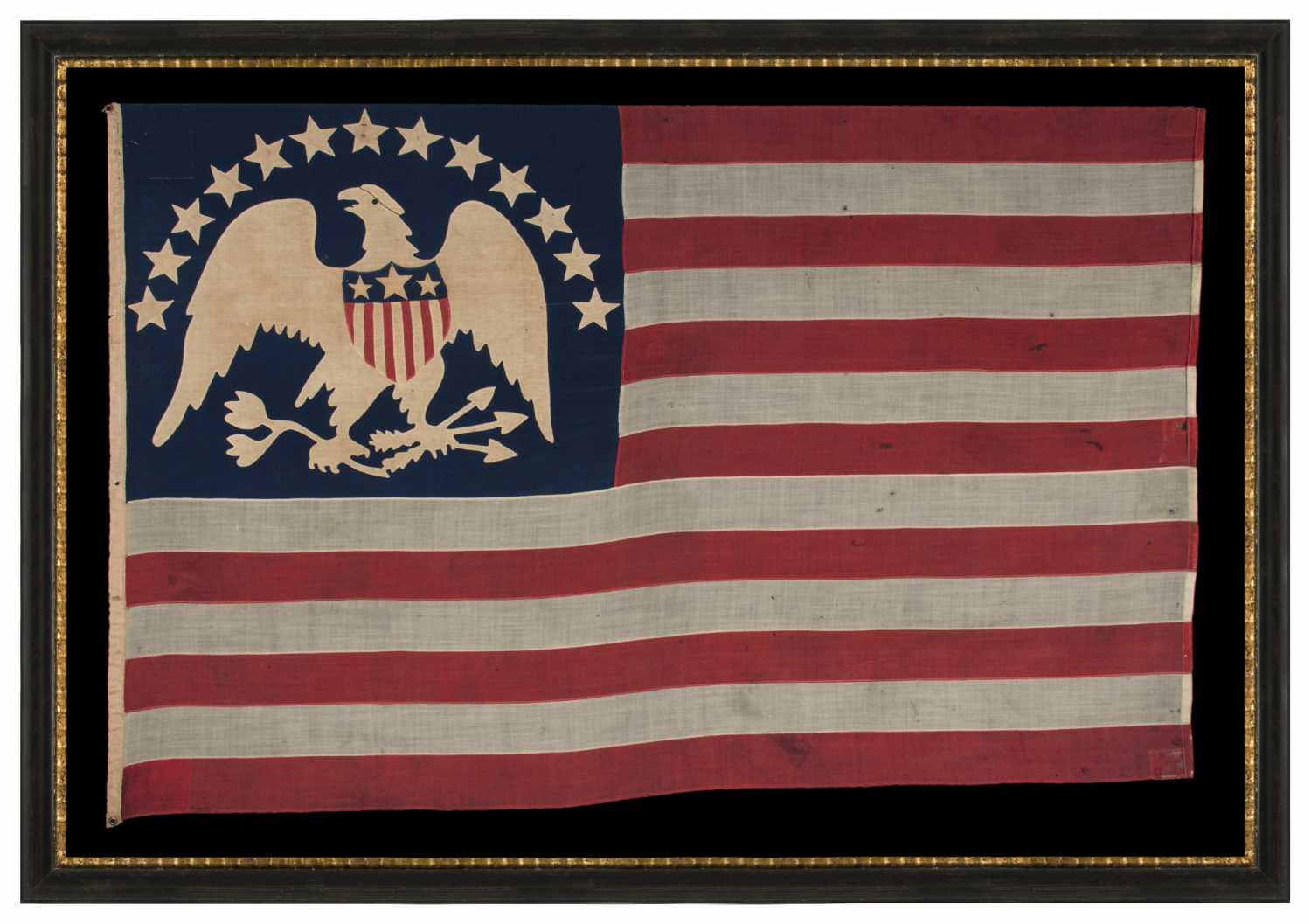 13 STAR ANTIQUE AMERICAN FLAG WITH A BROAD, ARCHED FORMATION OF HAND-SEWN, SINGLE-APPLIQUÉD STARS, ARCH ABOVE A BEAUTIFULLY HAND-SEWN FEDERAL EAGLE, ATTRIBUTED TO FLAG-MAKER SARAH McFADDEN – “NEW YORK’S BETSY ROSS” – AT 198 HUDSON STREET IN MANHATTAN, circa 1870-1880; EXHIBITED AT THE MUSEUM OF THE AMERICAN REVOLUTION FROM JUNE – JULY, 2019