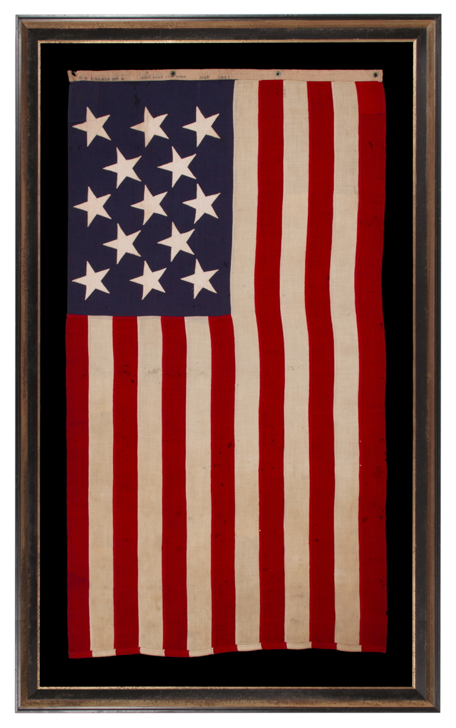 13 STAR ANTIQUE AMERICAN FLAG WITH A 3-2-3-2-3 PATTERN OF ESPECIALLY LARGE STARS; A U.S. NAVY SMALL BOAT ENSIGN, SIGNED & DATED 1914, MADE AT THE BROOKLYN NAVY YARD IN NEW YORK CITY