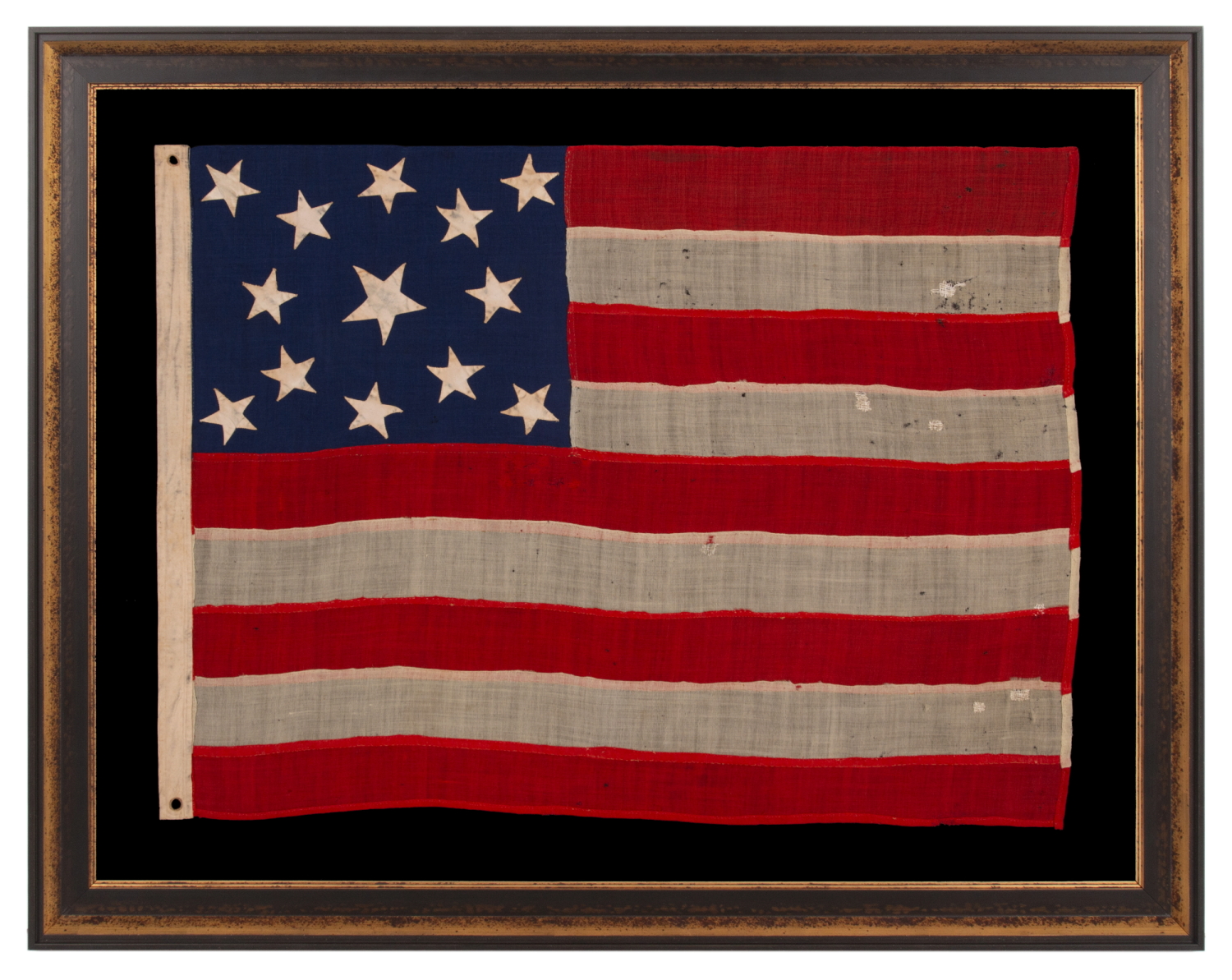 13 STAR ANTIQUE AMERICAN FLAG OF THE CIVIL WAR PERIOD (1861-1865), WITH 9 STRIPES TO REFLECT THE OMISSION OF NORTH & SOUTH CAROLINA, GEORGIA, & VIRGINIA, THE 4 SLAVE STATES AMONG THE ORIGINAL 13 COLONIES THAT SECEDED FROM THE UNION, WITH ITS CANTON RESTING ON THE WAR STRIPE, STRIKING COLOR, AND A BEAUTIFUL MEDALLION CONFIGURATION