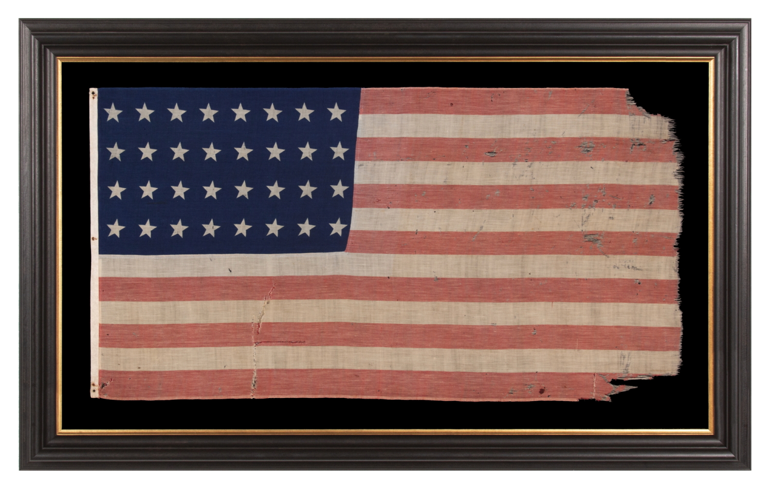 32 STAR ANTIQUE AMERICAN FLAG OF A TYPE KNOWN TO HAVE LIKELY SEEN MILITARY USE, REFLECTS THE ADDITION OF MINNESOTA TO THE UNION IN 1858, AN EXTREMELY RARE FLAG, ACCURATE FOR JUST 9 MONTHS AND OFFICIAL FOR ONLY ONE YEAR