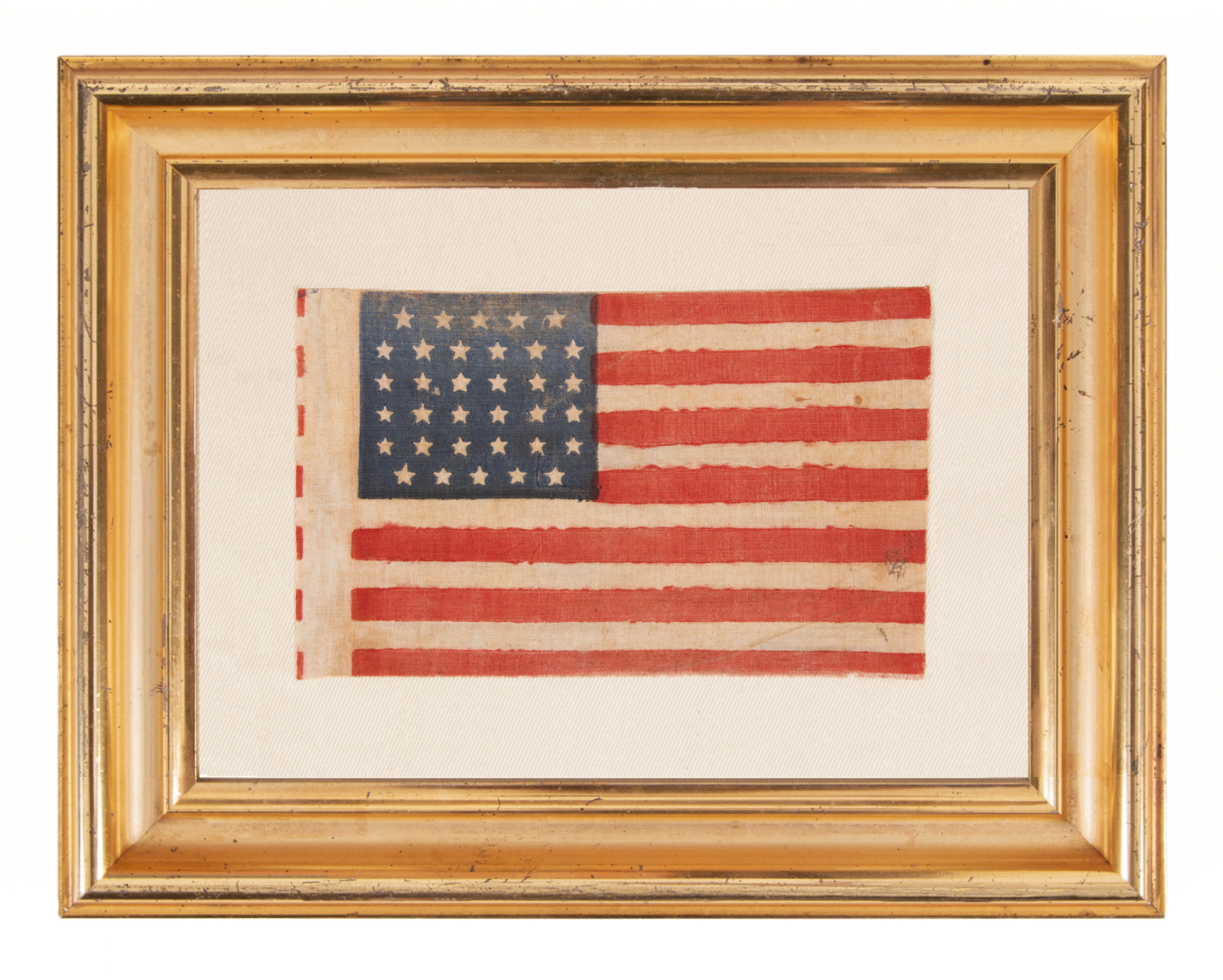 34 STAR ANTIQUE AMERICAN FLAG WITH A LINEAL ARRANGEMENT THAT I HAVE TERMED "GLOBAL ROWS, WITH EXCEPTIONAL COLOR AND CRUDE YET BEAUTIFUL FEATURES, OPENING TWO YEARS OF THE CIVIL WAR, 1861-63, KANSAS STATEHOOD