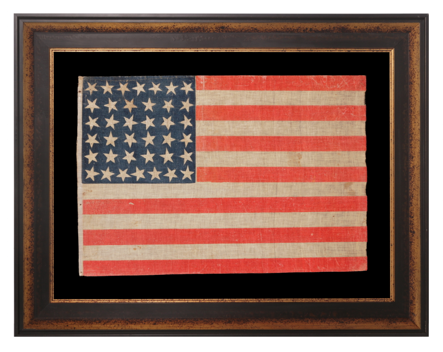 38 STAR ANTIQUE AMERICAN PARADE FLAG WITH JUSTIFIED ROWS OF 7-6-6-6-6-7 AND SCATTERED STAR ORIENTATION, MADE DURING THE PERIOD WHEN COLORADO WAS THE MOST RECENT STATE TO JOIN THE UNION, 1876-1889