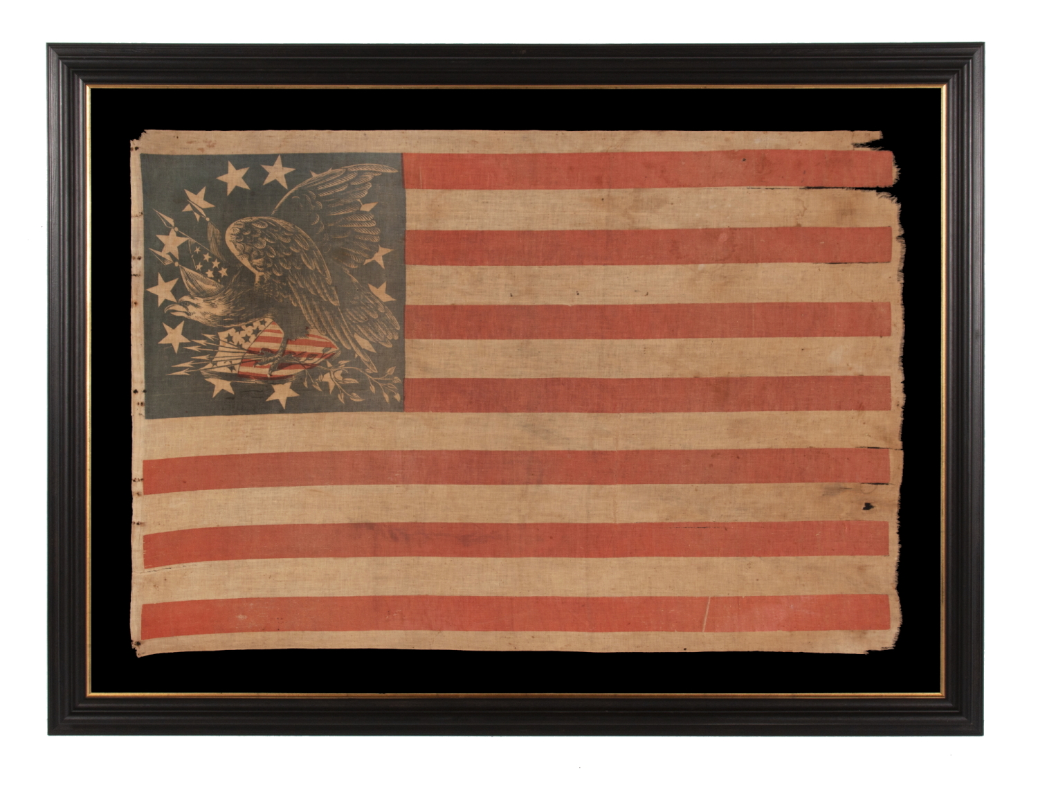EXTRAORDINARILY RARE ANTIQUE AMERICAN FLAG WITH A THREE-COLOR CANTON THAT CONSISTS OF A TREMENDOUS, WARLIKE EAGLE, PERCHED ON A FEDERAL SHIELD, SET WITHIN A RING OF 14 STARS; MADE IN THE PERIOD BETWEEN THE MEXICAN AND CIVIL WARS (1846 – 1865) THIS IS THE ONLY KNOWN EXAMPLE IN THIS STYLE AND THE LARGEST OF ALL KNOWN RECORDED PARADE FLAGS WITH AN EAGLE AS THE PRIMARY IMAGE